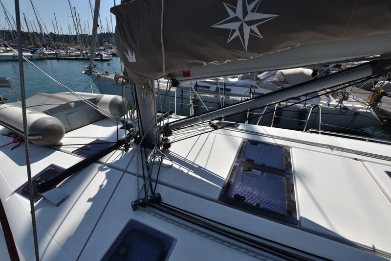 Blueconomy Yacht Photos Pics 2020 Jeanneau Sun Odyssey 490 sailboat deck with rigging and marina view.