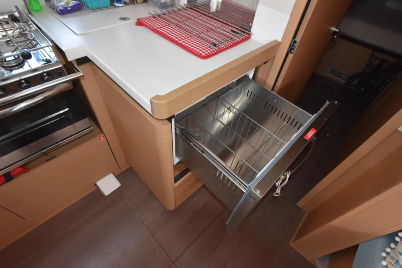 Blueconomy Yacht Photos Pics Modern kitchen area in 2020 Jeanneau Sun Odyssey 490 yacht with open drawer.