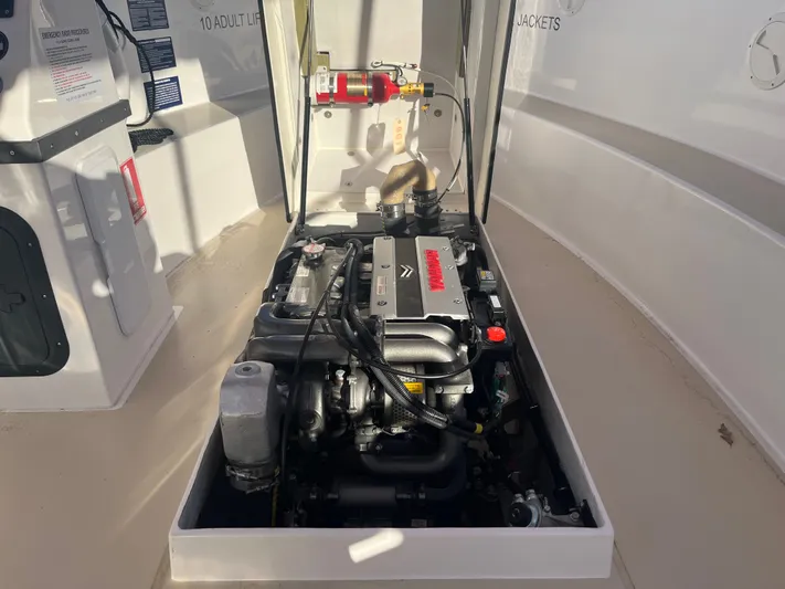 Joseph Packer Yacht Photos Pics 2024 Duffy 26 Water Taxi engine compartment with visible components and safety equipment.