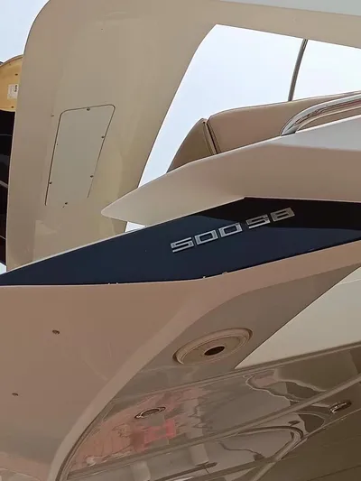  Yacht Photos Pics 2011 Marquis 500 Sport Bridge yacht, sleek design, close-up view.