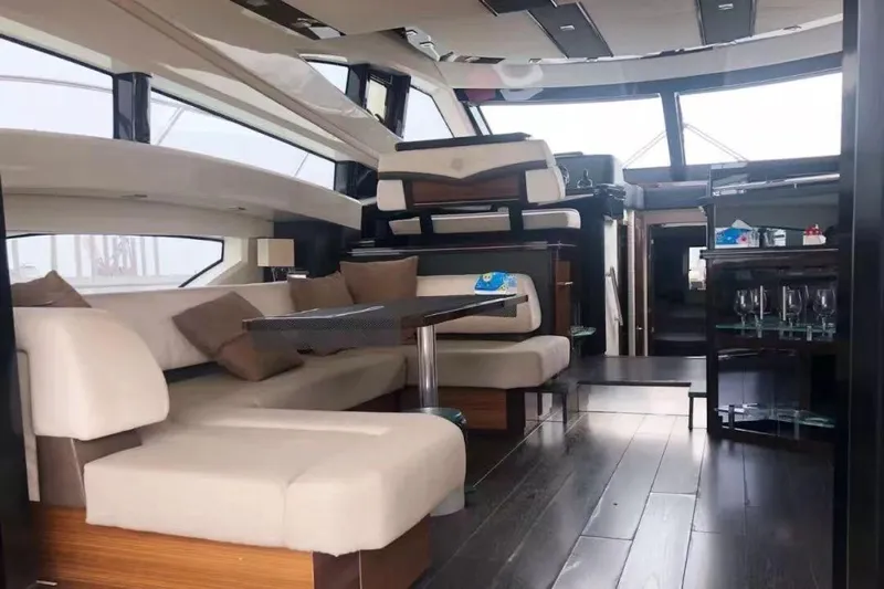 Yacht Photos Pics Luxurious interior of 2011 Marquis 500 Sport Bridge yacht with elegant seating and modern design.