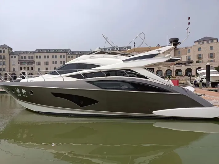  Yacht Photos Pics 2011 Marquis 500 Sport Bridge yacht docked in marina.