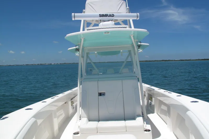  Yacht Photos Pics 2024 SeaVee 370z boat on calm blue water under clear sky.