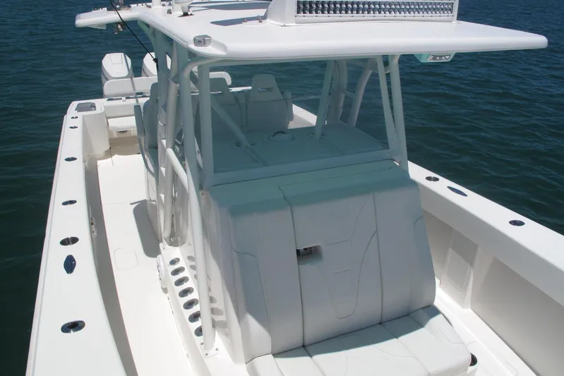  Yacht Photos Pics 2024 SeaVee 370z boat with sleek white design on calm water.