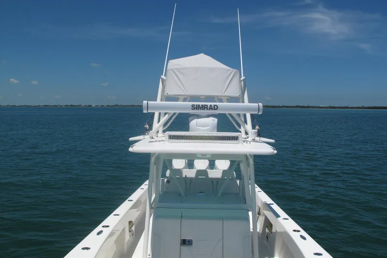  Yacht Photos Pics 2024 SeaVee 370z boat on calm ocean with clear blue sky.