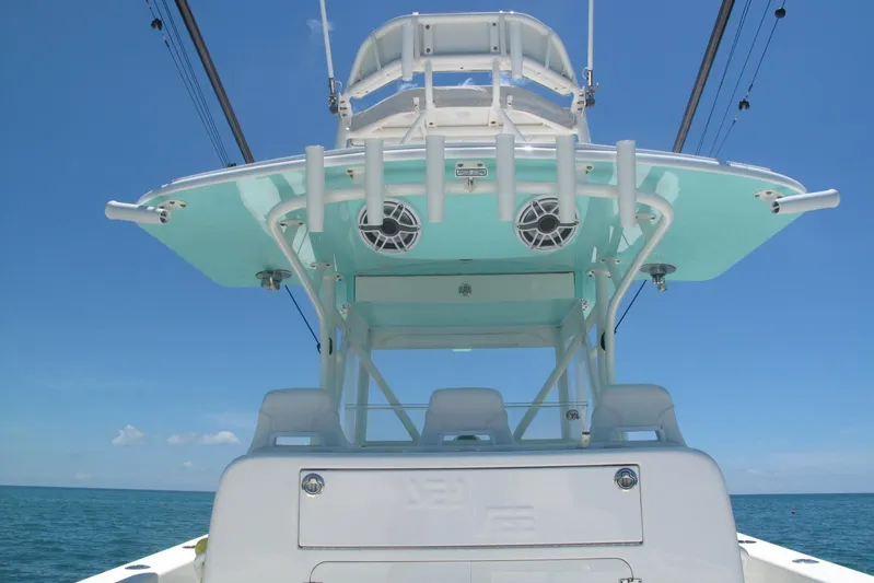  Yacht Photos Pics 2024 SeaVee 370z boat, featuring a sleek design and modern amenities, against a clear blue sky.