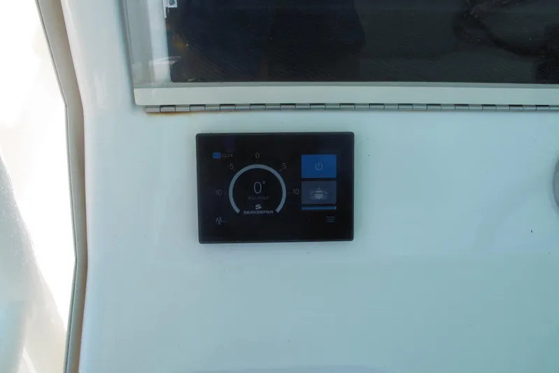  Yacht Photos Pics 2024 SeaVee 370z control panel displaying Seakeeper roll angle gauge.