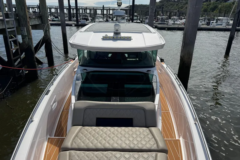  Yacht Photos Pics 2022 Axopar 37 XC CROSS CABIN boat docked at marina, featuring sleek design and spacious deck.