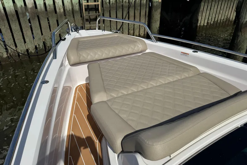  Yacht Photos Pics Luxurious seating on 2022 Axopar 37 XC CROSS CABIN boat, featuring quilted upholstery.