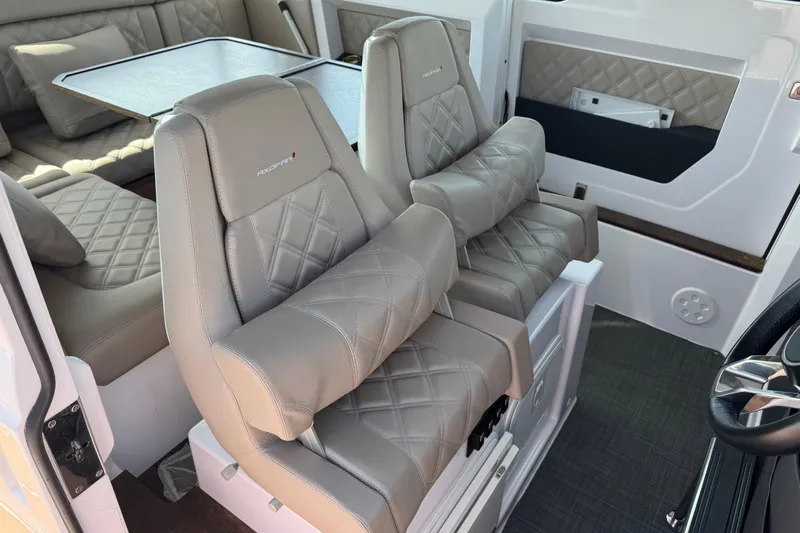  Yacht Photos Pics Luxurious interior of 2022 Axopar 37 XC CROSS CABIN with plush seating and table.