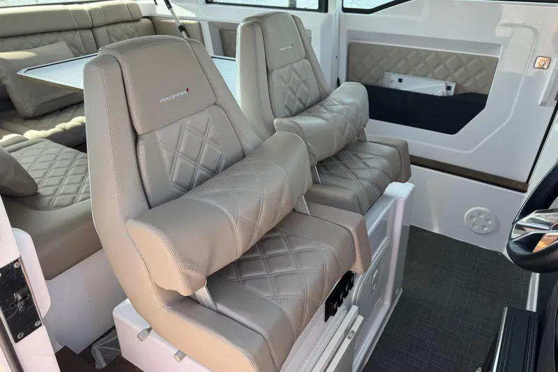  Yacht Photos Pics Luxurious interior of 2022 Axopar 37 XC CROSS CABIN with plush seating and modern design.