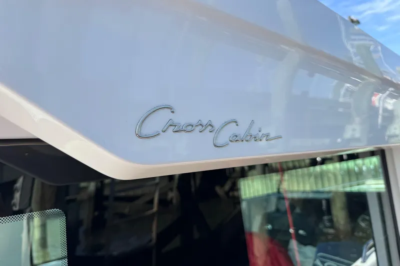  Yacht Photos Pics 2022 Axopar 37 XC Cross Cabin logo on boat exterior.