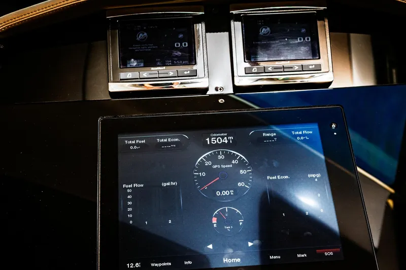  Yacht Photos Pics Dashboard of a 2015 Regal 53 Sport Coupe displaying fuel and speed metrics.