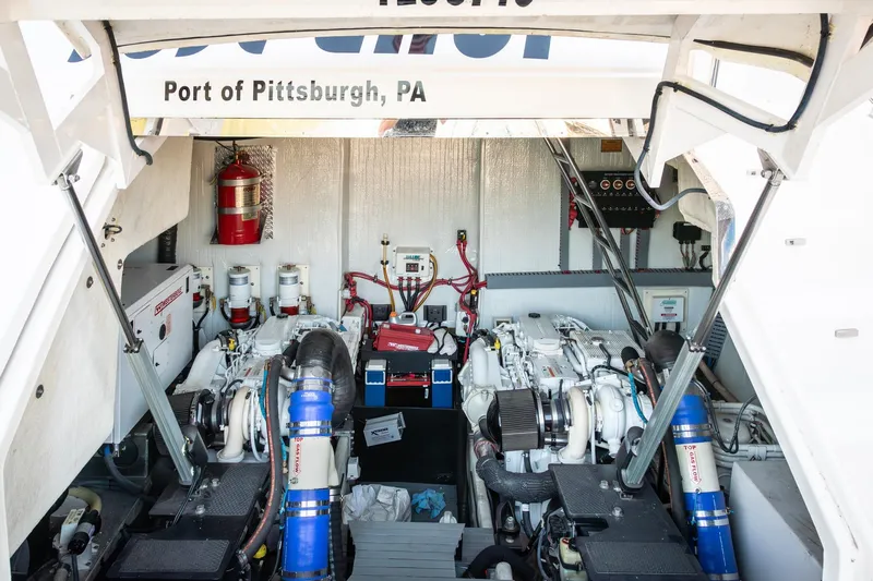  Yacht Photos Pics Engine room of 2015 Regal 53 Sport Coupe, featuring dual engines and fire safety equipment.