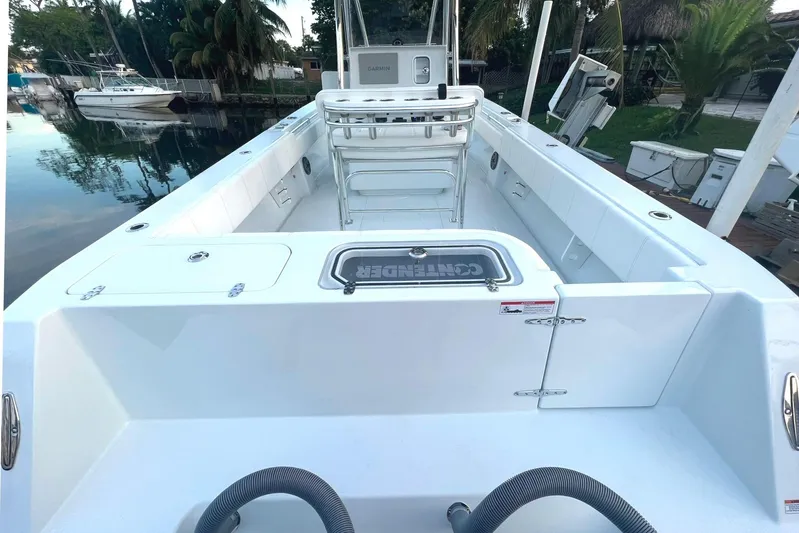  Yacht Photos Pics 2023 Contender 30 Tournament boat interior, featuring spacious deck and modern equipment.