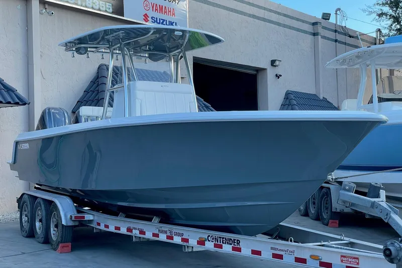  Yacht Photos Pics 2023 Contender 30 Tournament boat on trailer, parked outside dealership.