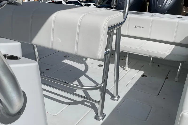  Yacht Photos Pics 2023 Contender 30 Tournament boat interior with white seating and stainless steel fixtures.