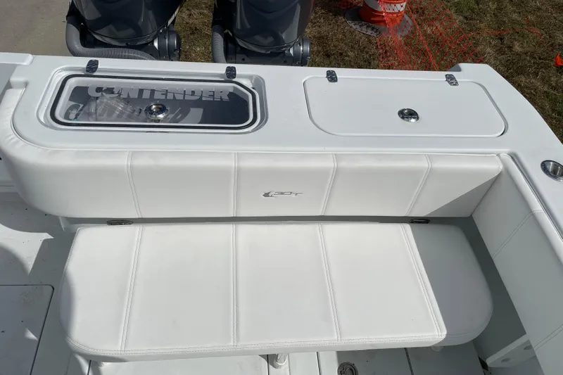  Yacht Photos Pics 2023 Contender 30 Tournament boat interior with seating and storage compartments.