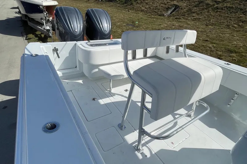  Yacht Photos Pics 2023 Contender 30 Tournament boat interior with seating and dual outboard engines.