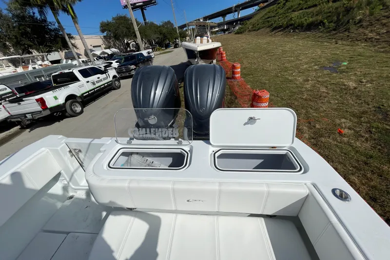  Yacht Photos Pics 2023 Contender 30 Tournament boat with dual engines and open storage compartments.
