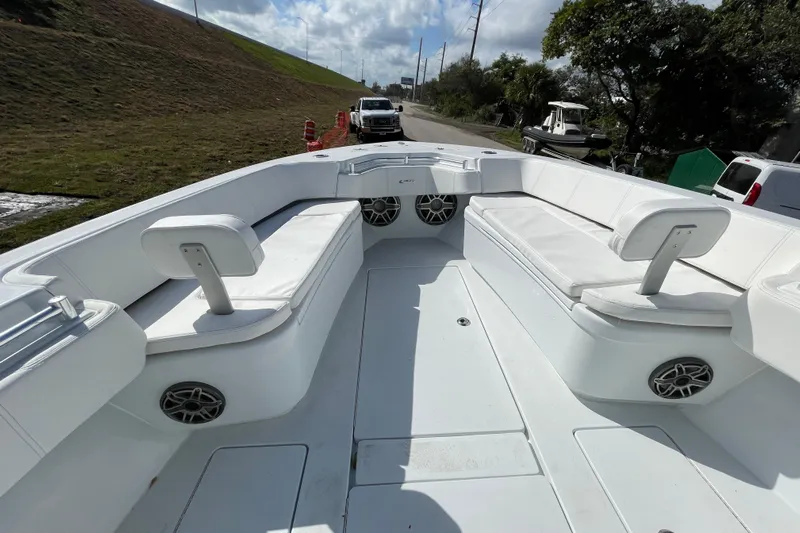  Yacht Photos Pics 2023 Contender 30 Tournament boat interior with white seating and speakers.