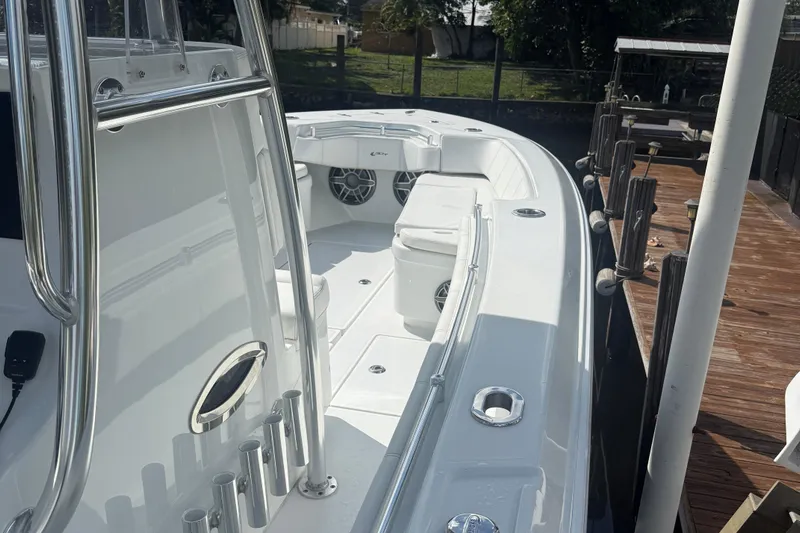  Yacht Photos Pics 2023 Contender 30 Tournament boat docked, showcasing sleek design and spacious deck.