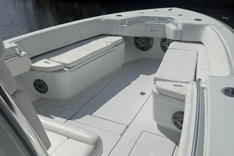  Yacht Photos Pics 2023 Contender 30 Tournament boat interior with white seating and speakers.