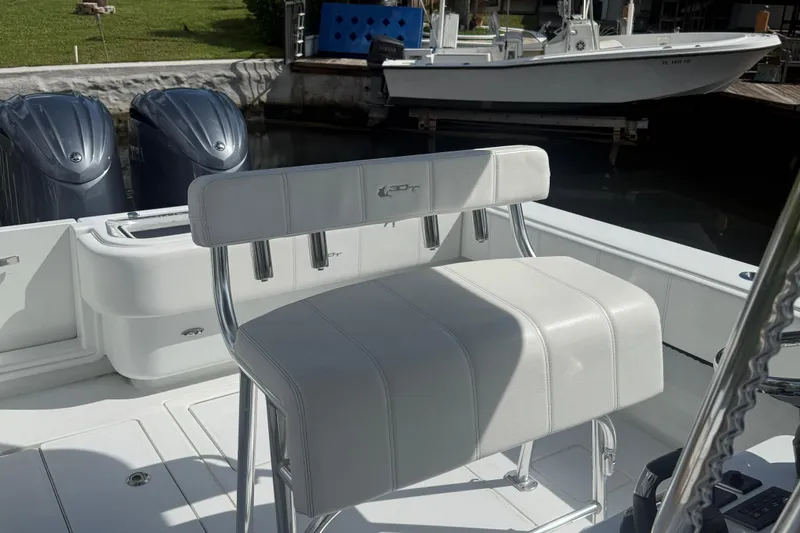 Yacht Photos Pics 2023 Contender 30 Tournament boat interior with dual engines and white seating.
