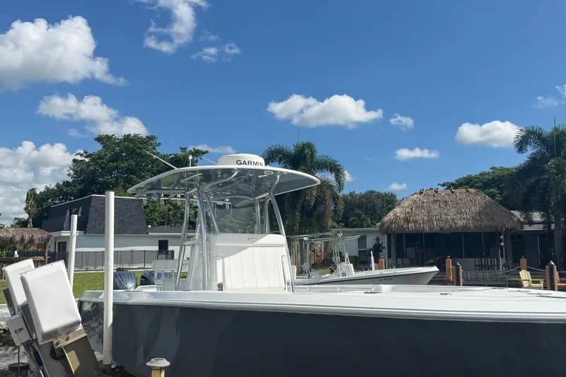  Yacht Photos Pics 2023 Contender 30 Tournament boat docked under clear blue sky.