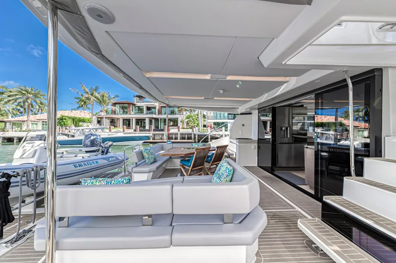 Double Feature Yacht Photos Pics Luxurious 2023 Leopard 53 Powercat yacht with spacious deck and modern seating.