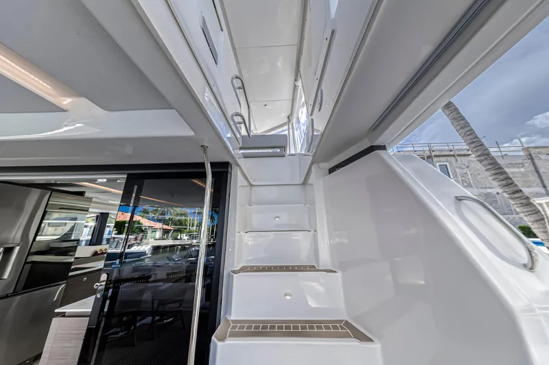 Double Feature Yacht Photos Pics Staircase on 2023 Leopard 53 Powercat yacht, leading to upper deck with modern design.