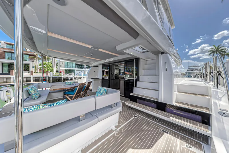 Double Feature Yacht Photos Pics Luxurious 2023 Leopard 53 Powercat yacht with spacious deck and modern seating.