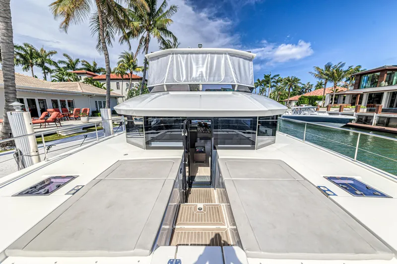 Double Feature Yacht Photos Pics 2023 Leopard 53 Powercat yacht docked, featuring spacious deck and modern design.