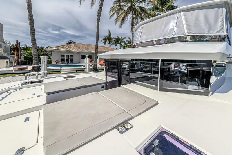 Double Feature Yacht Photos Pics 2023 Leopard 53 Powercat yacht docked, featuring spacious deck and modern design.
