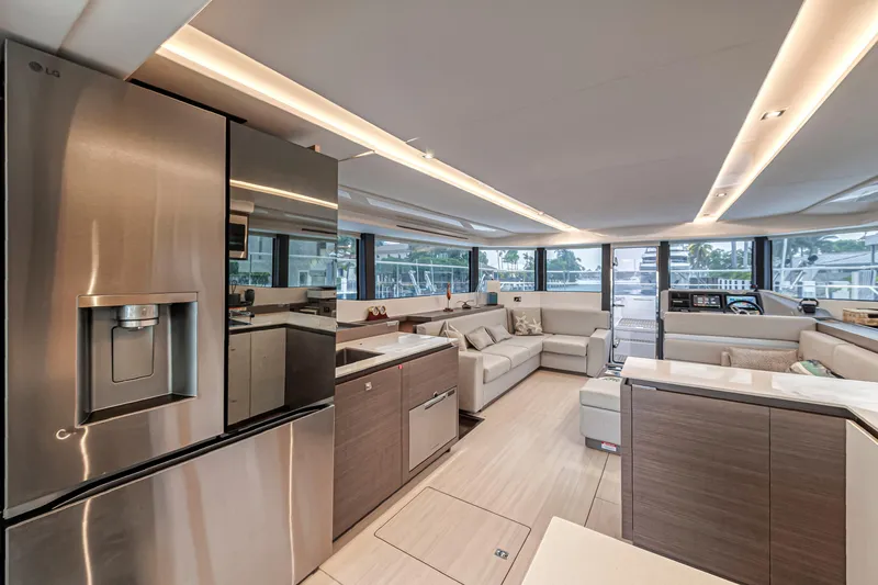Double Feature Yacht Photos Pics Luxurious interior of 2023 Leopard 53 Powercat yacht with modern kitchen and spacious seating area.