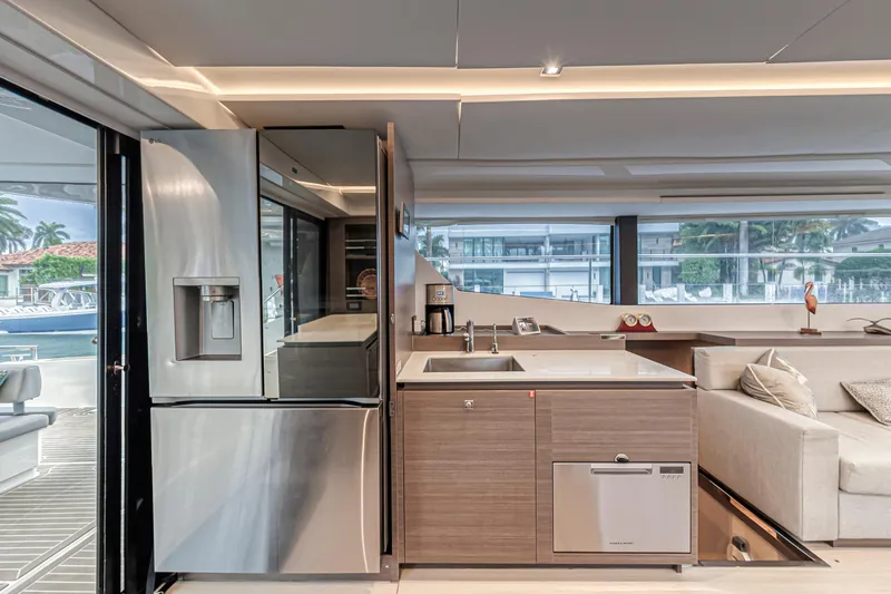 Double Feature Yacht Photos Pics Modern kitchen interior on 2023 Leopard 53 Powercat yacht, featuring sleek appliances and stylish design.