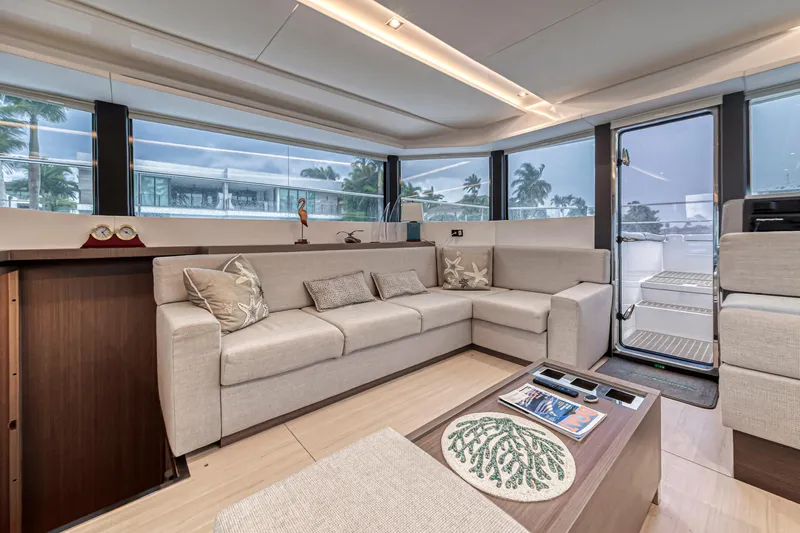 Double Feature Yacht Photos Pics Luxurious interior of 2023 Leopard 53 Powercat yacht with modern seating and panoramic windows.