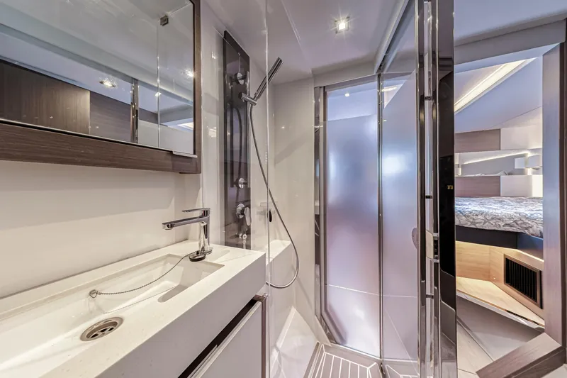 Double Feature Yacht Photos Pics Luxurious bathroom in 2023 Leopard 53 Powercat yacht with modern fixtures and spacious shower.