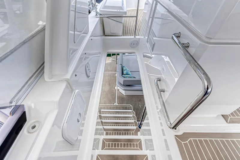 Double Feature Yacht Photos Pics 2023 Leopard 53 Powercat interior with sleek white design and modern staircase.
