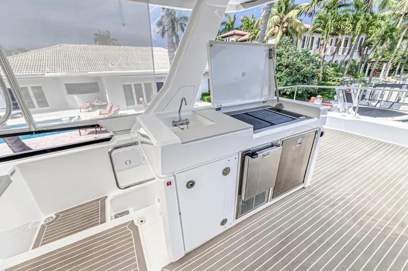 Double Feature Yacht Photos Pics Outdoor kitchen on 2023 Leopard 53 Powercat yacht with grill and sink.