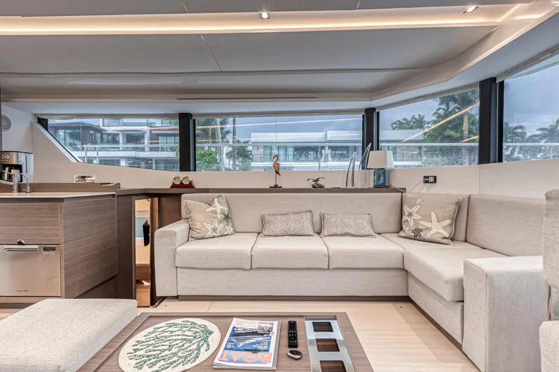Double Feature Yacht Photos Pics Luxurious interior of 2023 Leopard 53 Powercat yacht with modern furnishings and panoramic windows.