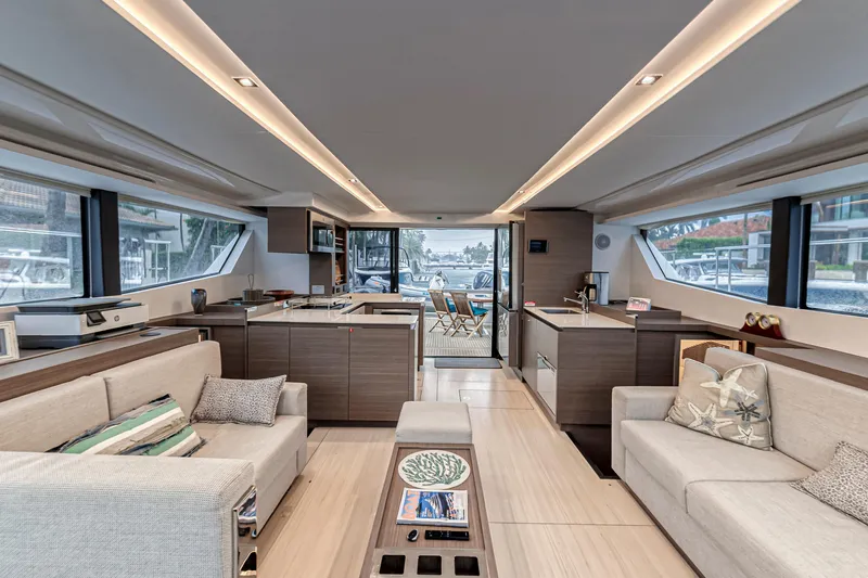 Double Feature Yacht Photos Pics Luxurious interior of 2023 Leopard 53 Powercat yacht with modern furnishings and panoramic windows.