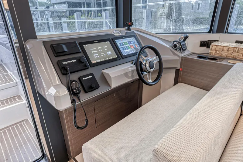 Double Feature Yacht Photos Pics 2023 Leopard 53 Powercat helm with modern navigation controls and comfortable seating.