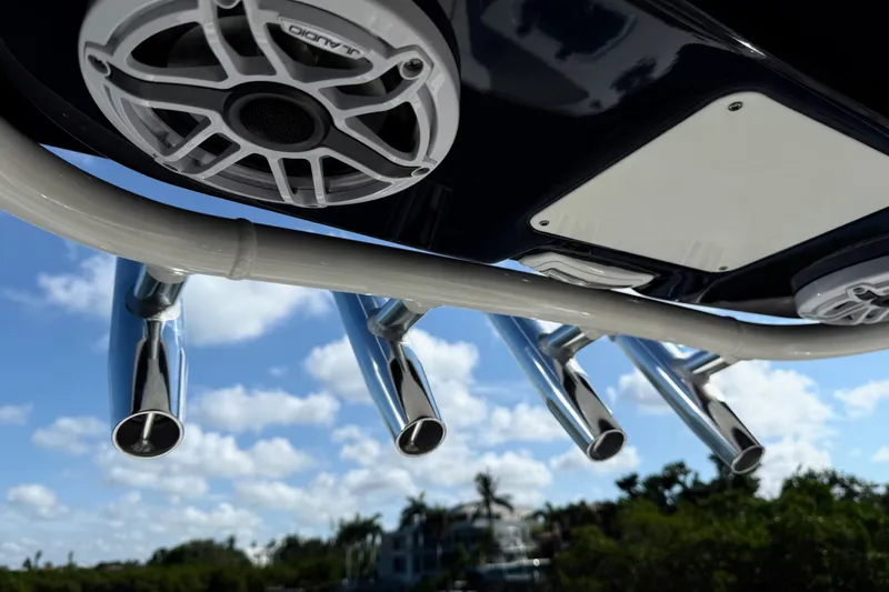  Yacht Photos Pics 2024 Pursuit S 248 Sport boat speakers and rod holders against a blue sky.