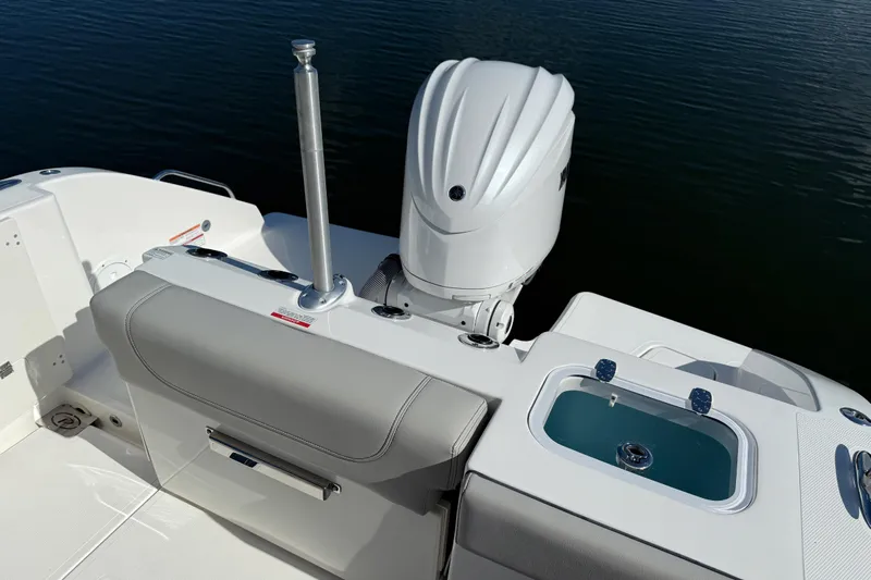  Yacht Photos Pics 2024 Pursuit S 248 Sport boat with outboard motor and seating area.