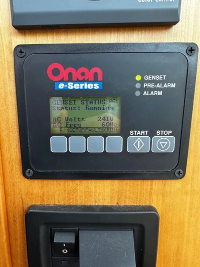 Dawn Treader Yacht Photos Pics Onan e-Series generator control panel displaying status and voltage on a 2008 Sabre 42 Hard Top Express.