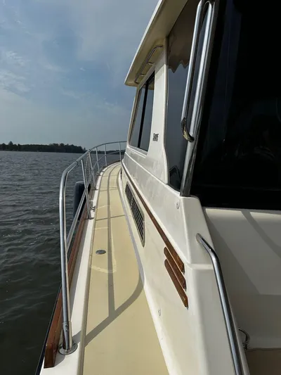 Dawn Treader Yacht Photos Pics 2008 Sabre 42 Hard Top Express yacht on calm waters, side view.
