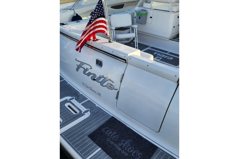  Yacht Photos Pics 2001 Tiara Yachts 3500 Open with American flag, docked in St. Clair Shores, MI.