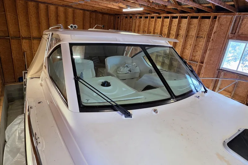  Yacht Photos Pics 2007 Tiara Yachts 3000 Open boat stored indoors, showcasing windshield and interior seating.