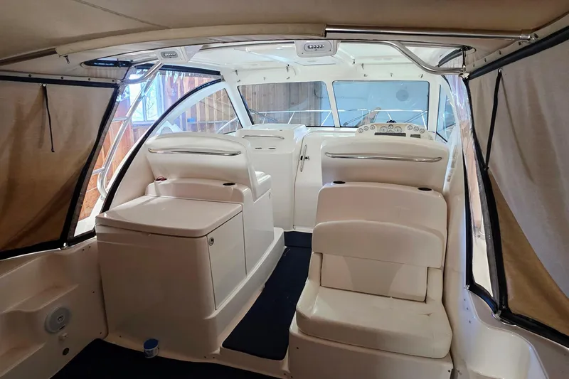  Yacht Photos Pics Interior of 2007 Tiara Yachts 3000 Open, featuring white seating and helm station.
